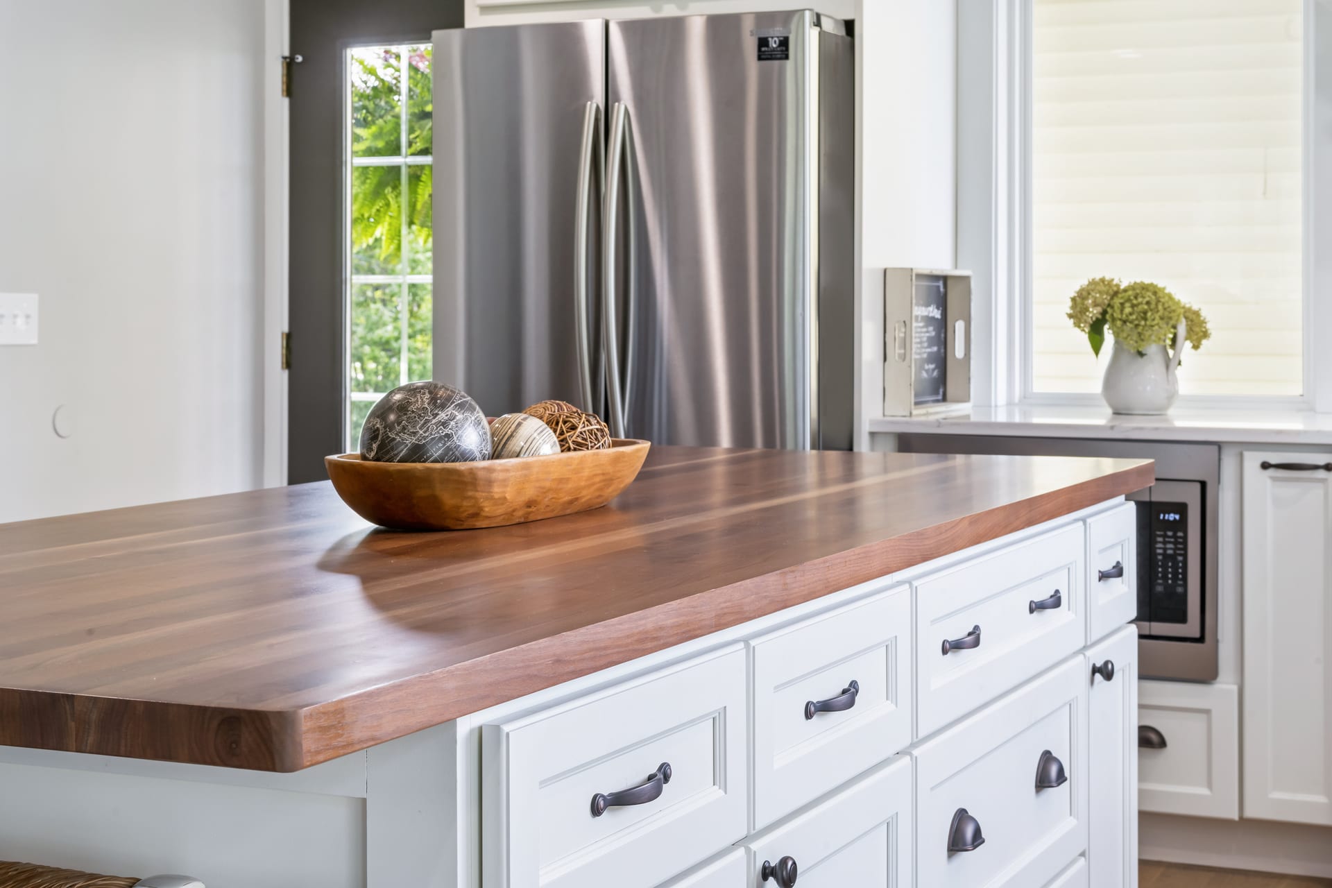 Remodeled kitchen with island in Cleeter residence