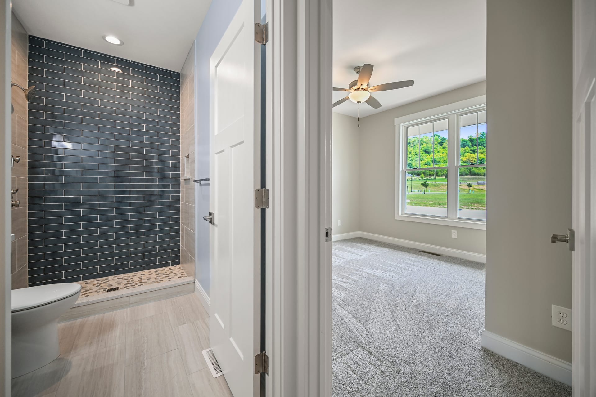 Master bedroom with crown molding and natural light