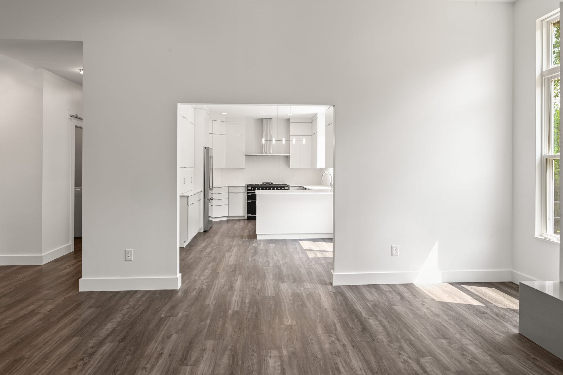 Dining room with chandelier and wainscoting in custom home