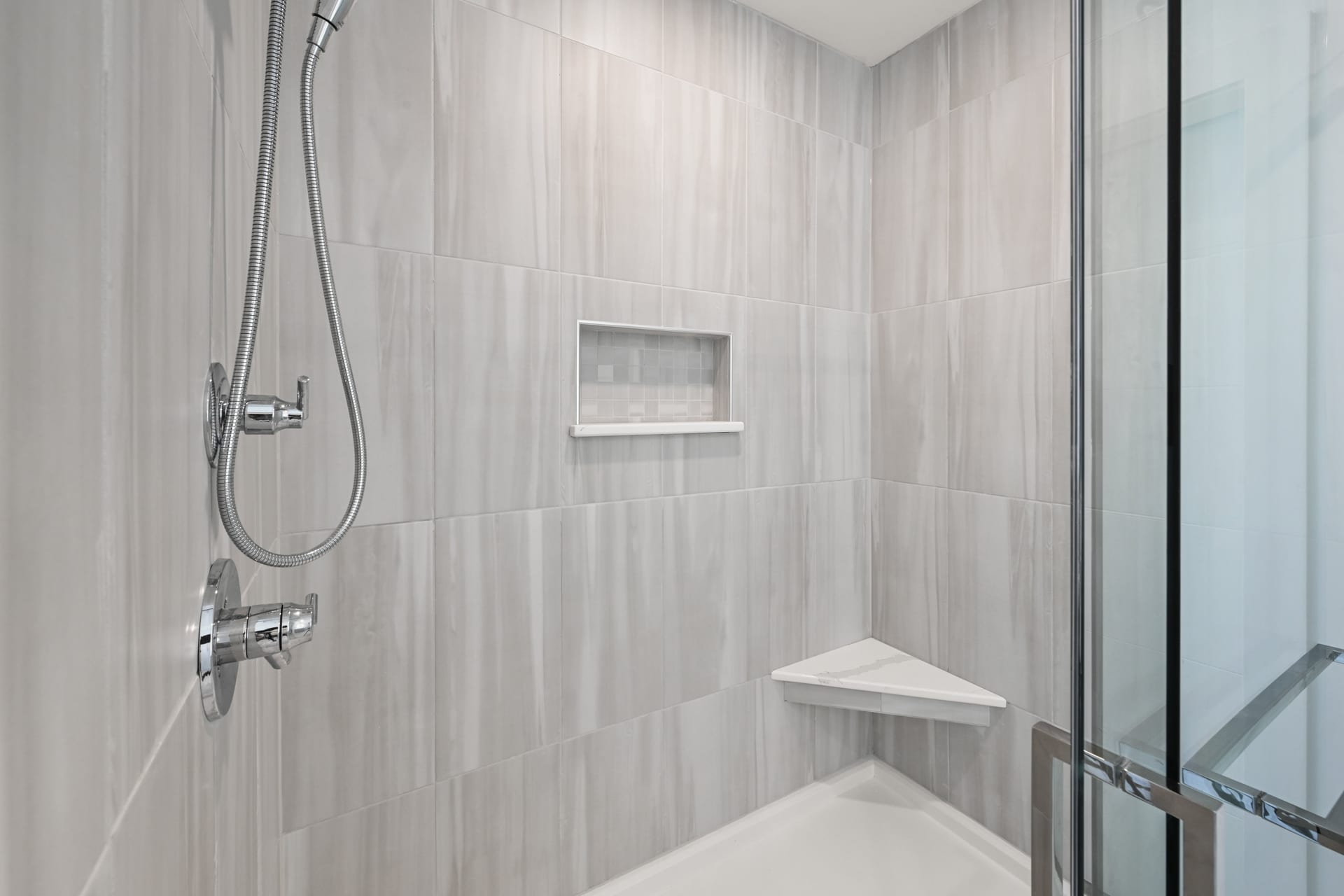 Master bathroom with freestanding tub and marble tile