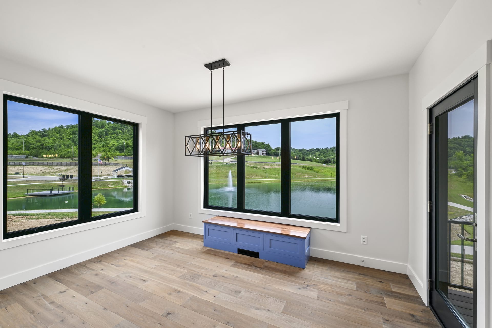 Kitchen pendant lights and island detail in custom home