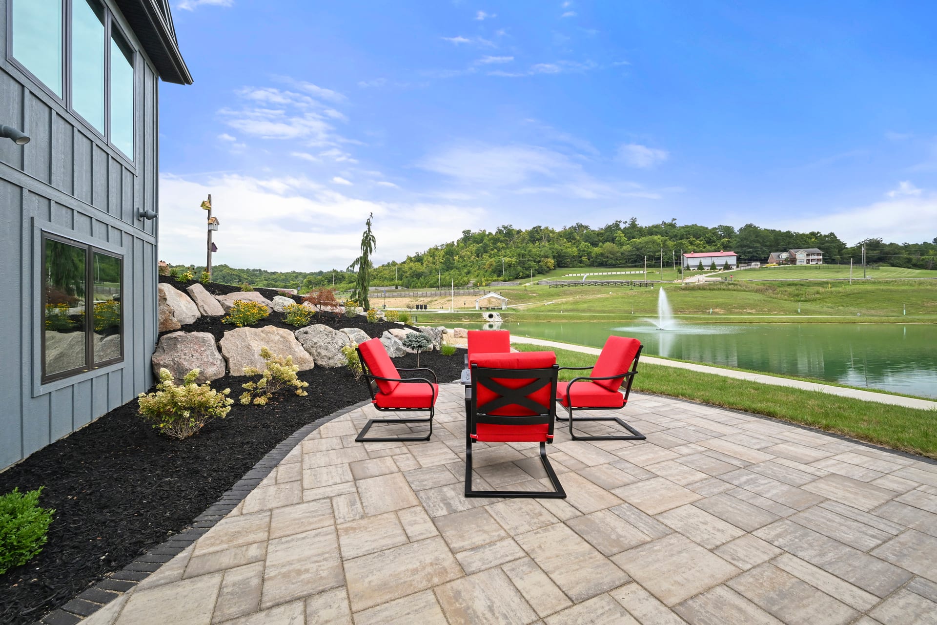 Completed custom home exterior with mature landscaping