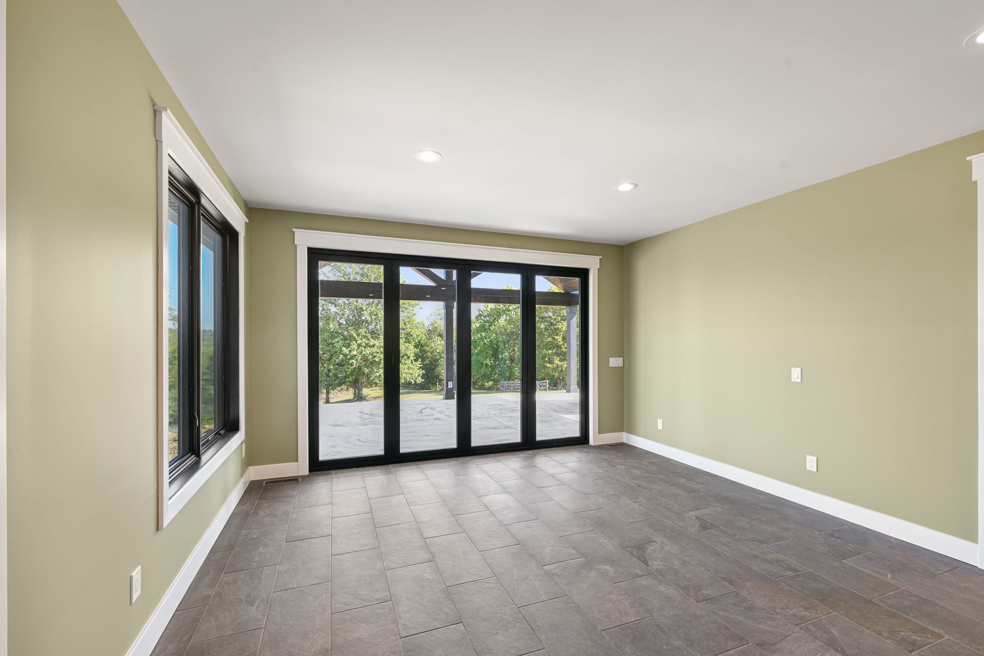 Rear exterior and yard of remodeled Drouge residence